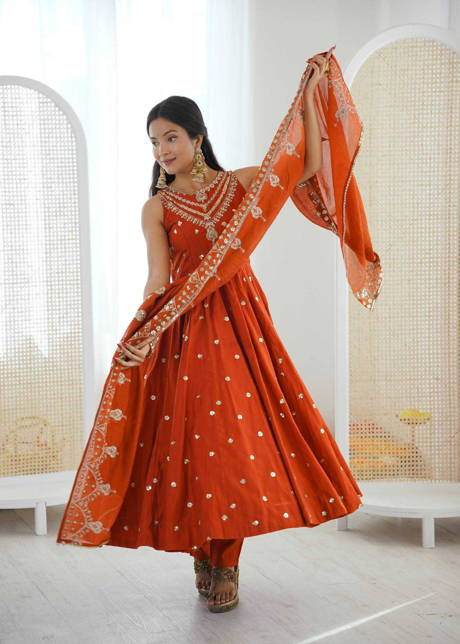 YNF Wholesale Heavy Roman Silk Embroidery Gowns  | Surat Manufacturer