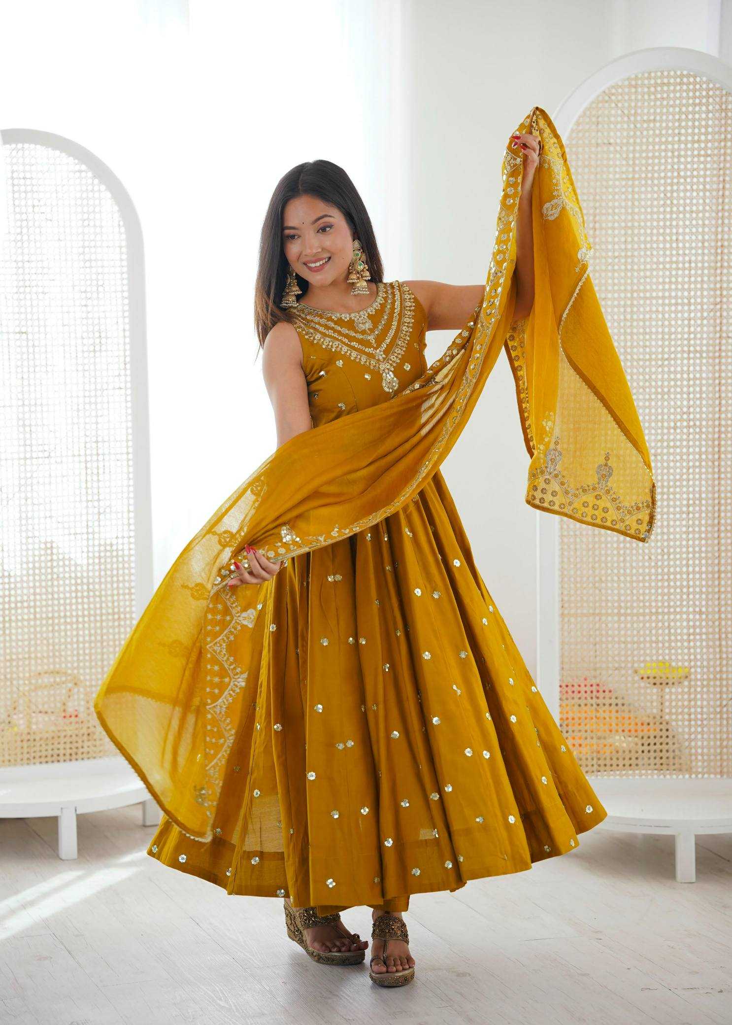 YNF Wholesale Heavy Roman Silk Embroidery Gowns  | Surat Manufacturer