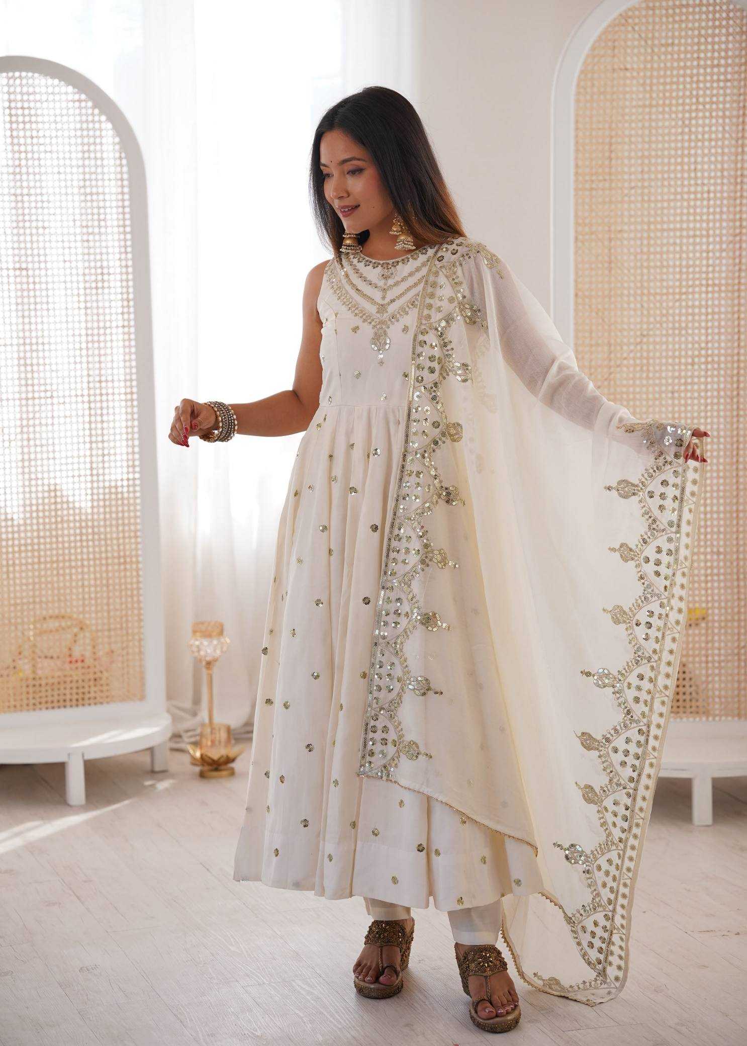 YNF Wholesale Heavy Roman Silk Embroidery Gowns  | Surat Manufacturer