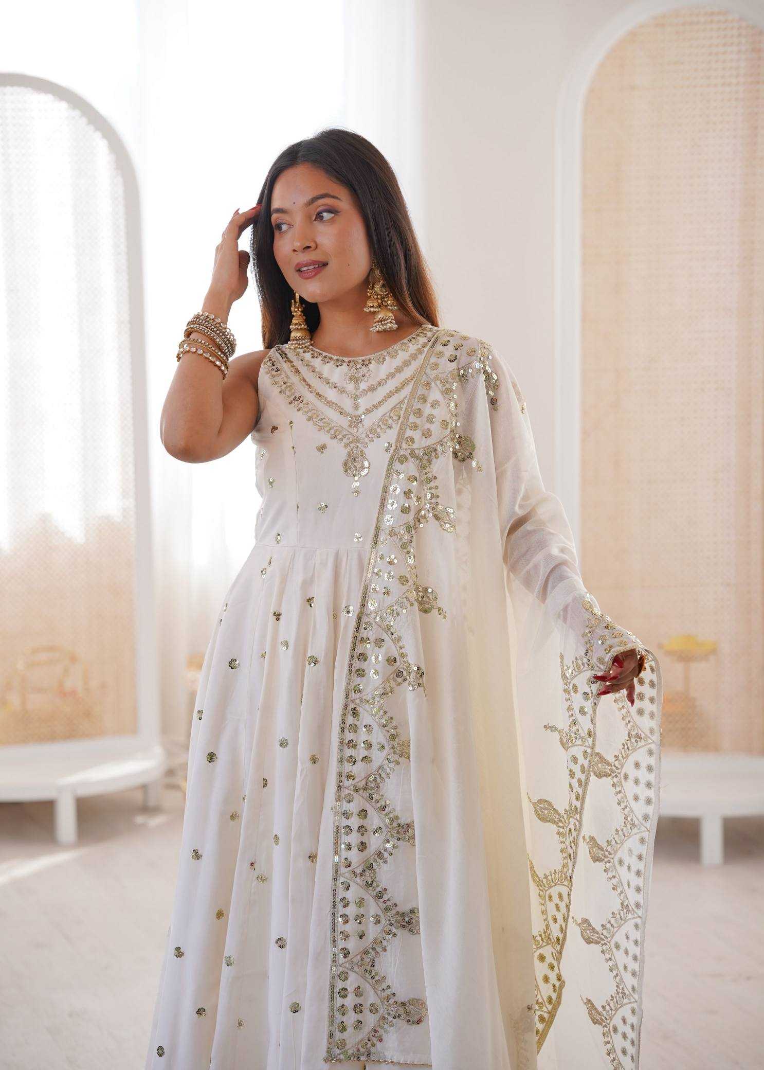 YNF Wholesale Heavy Roman Silk Embroidery Gowns  | Surat Manufacturer