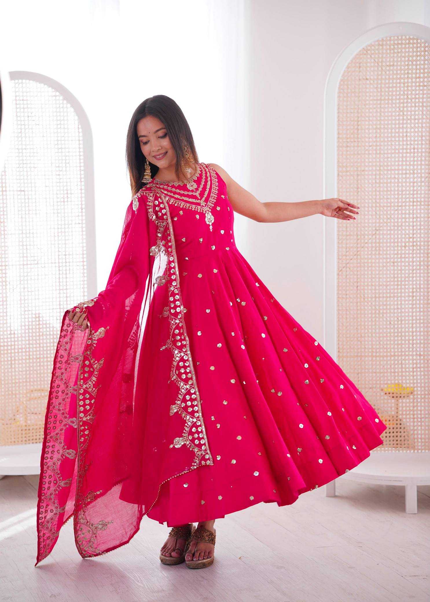YNF Wholesale Heavy Roman Silk Embroidery Gowns  | Surat Manufacturer