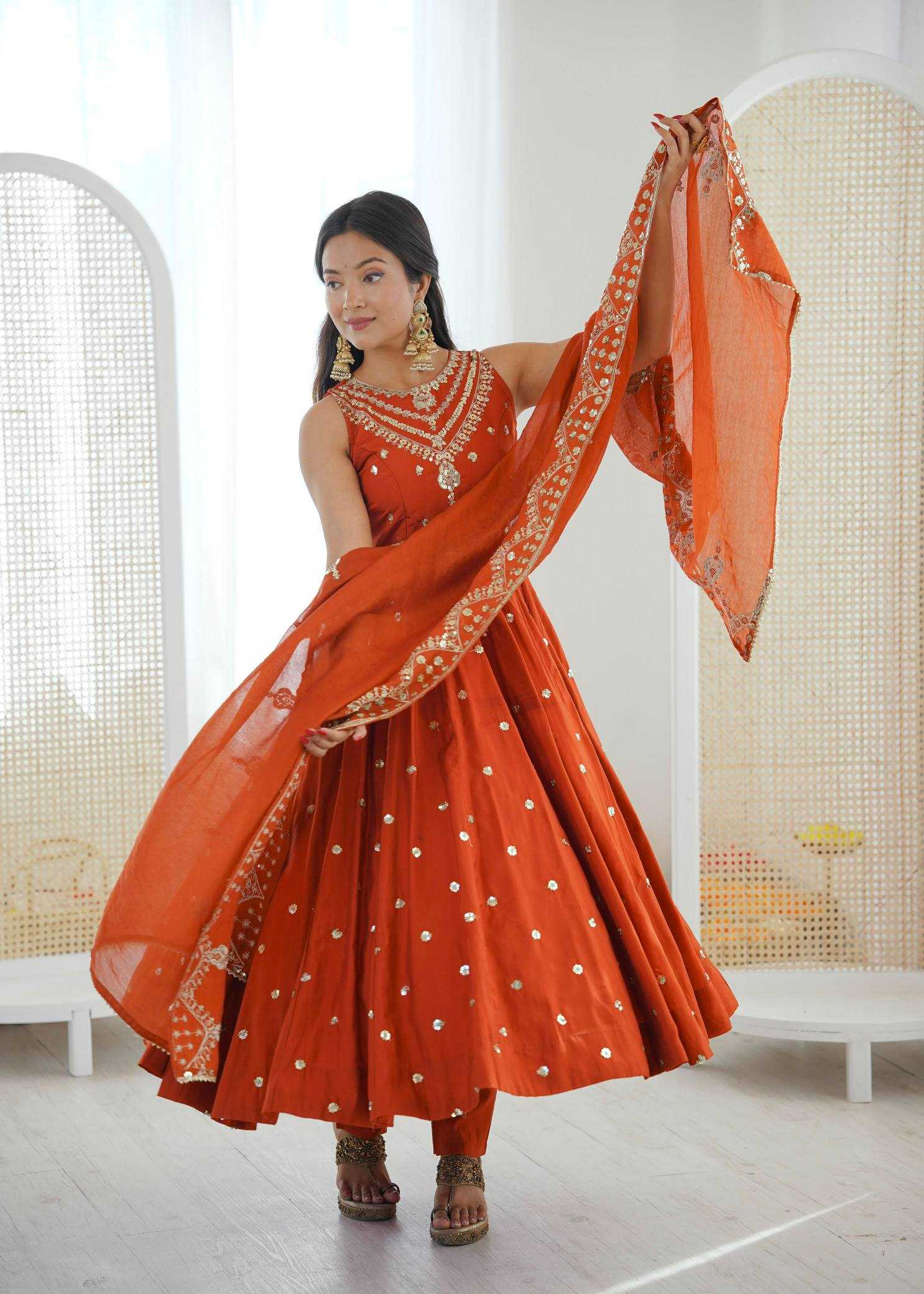 YNF Wholesale Heavy Roman Silk Embroidery Gowns  | Surat Manufacturer