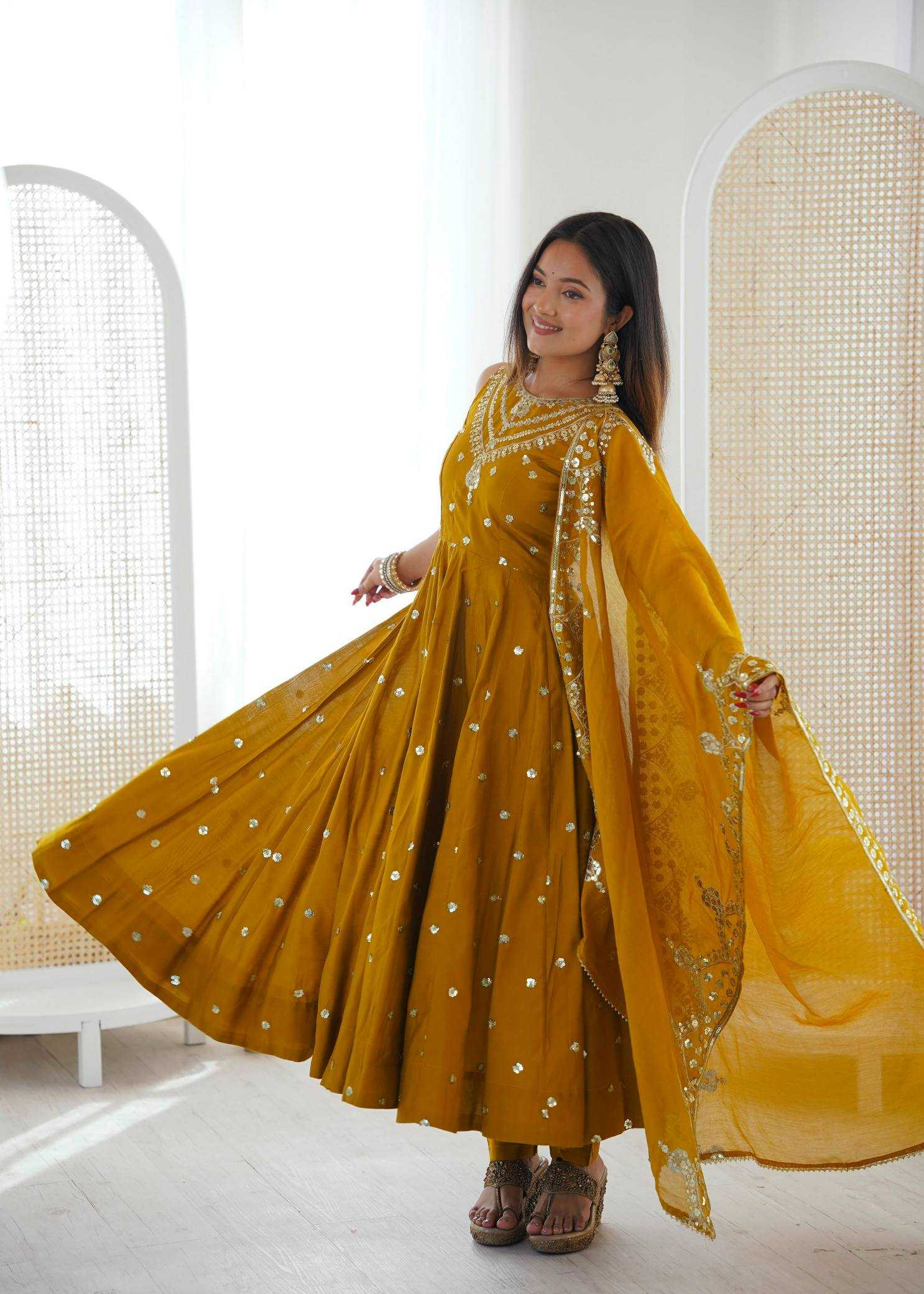 YNF Wholesale Heavy Roman Silk Embroidery Gowns  | Surat Manufacturer
